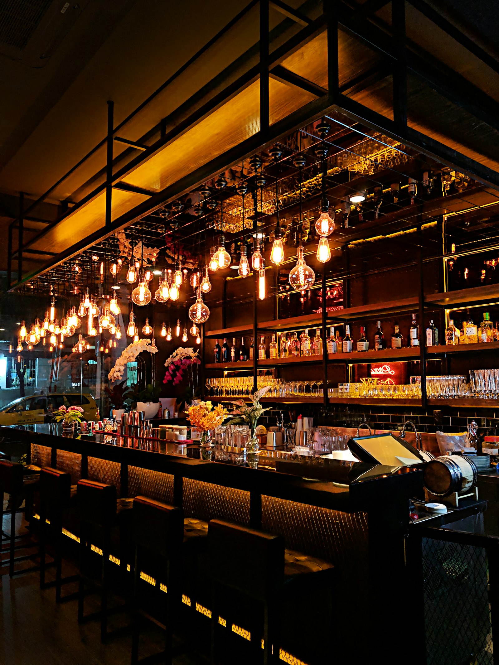 A softly lit private members' lounge with warm amber lighting